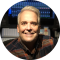 Headshot of producer Rob Denis, an iZotope artist using the software for modern music production.