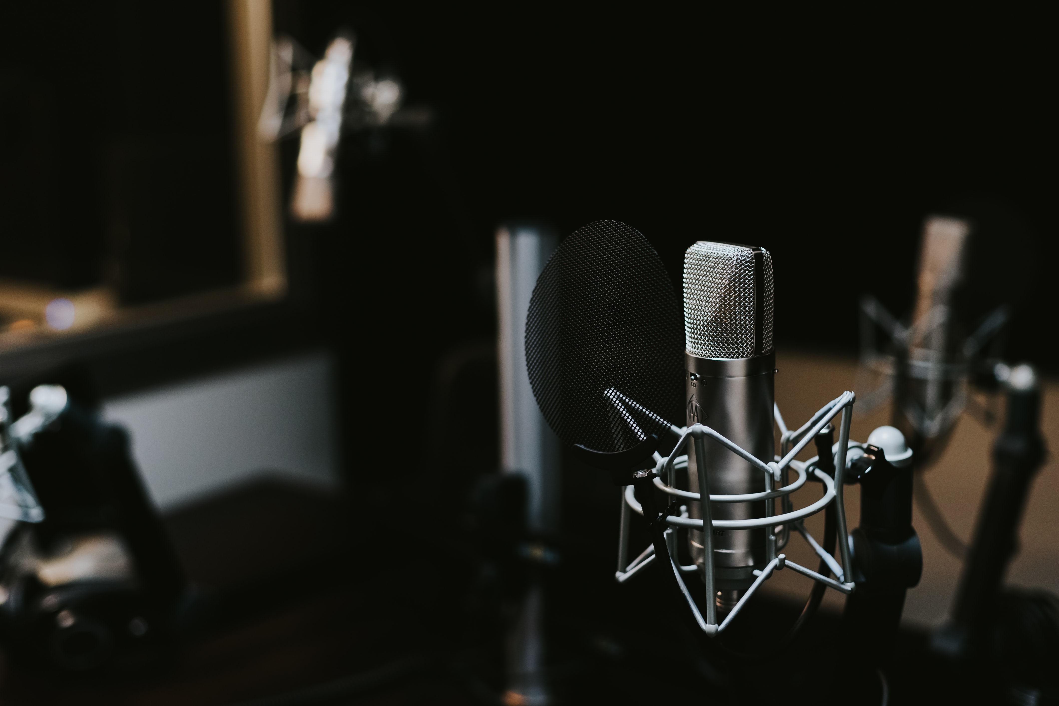 Experiment with indirect microphone placement in your podcast studio to find a natural-sounding recording with reduced plosives.
